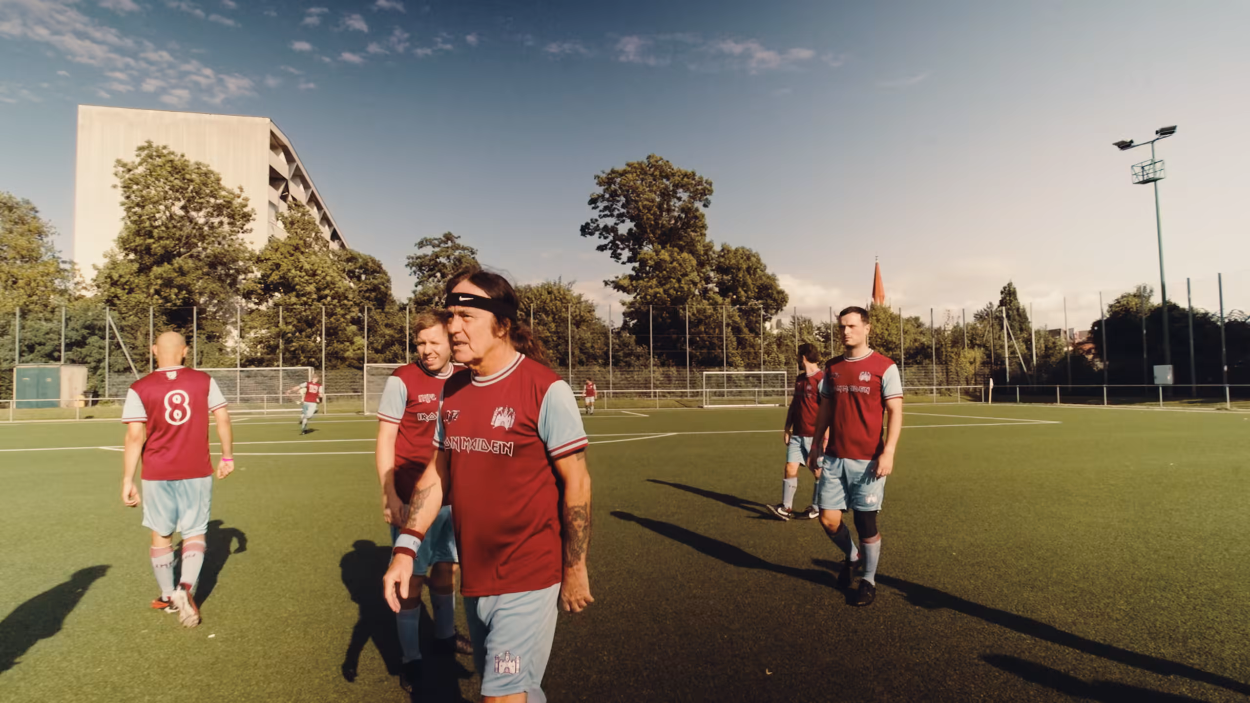 Steve Harris and fellow players on the football pitch