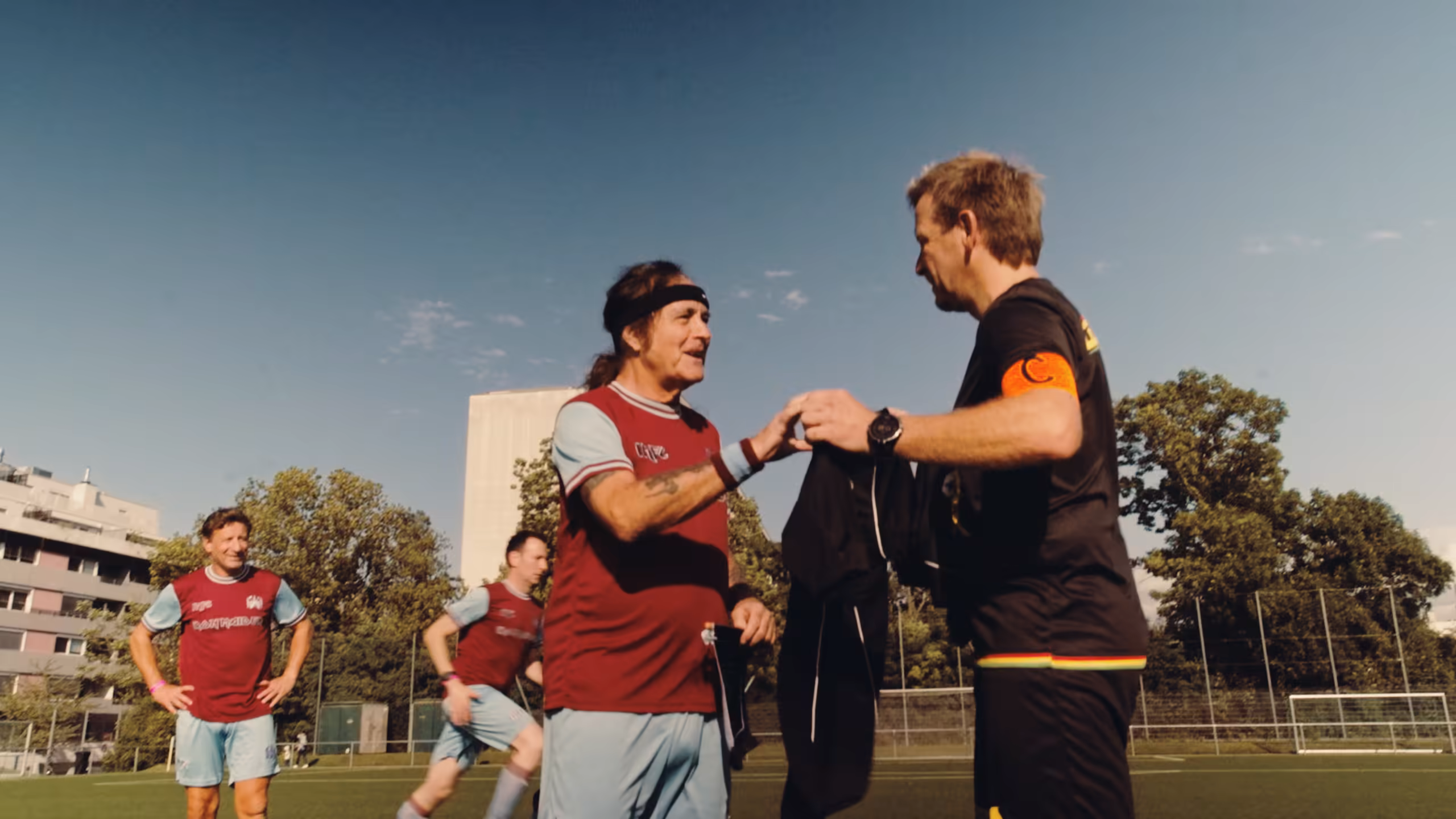 Players from both teams greeting each other