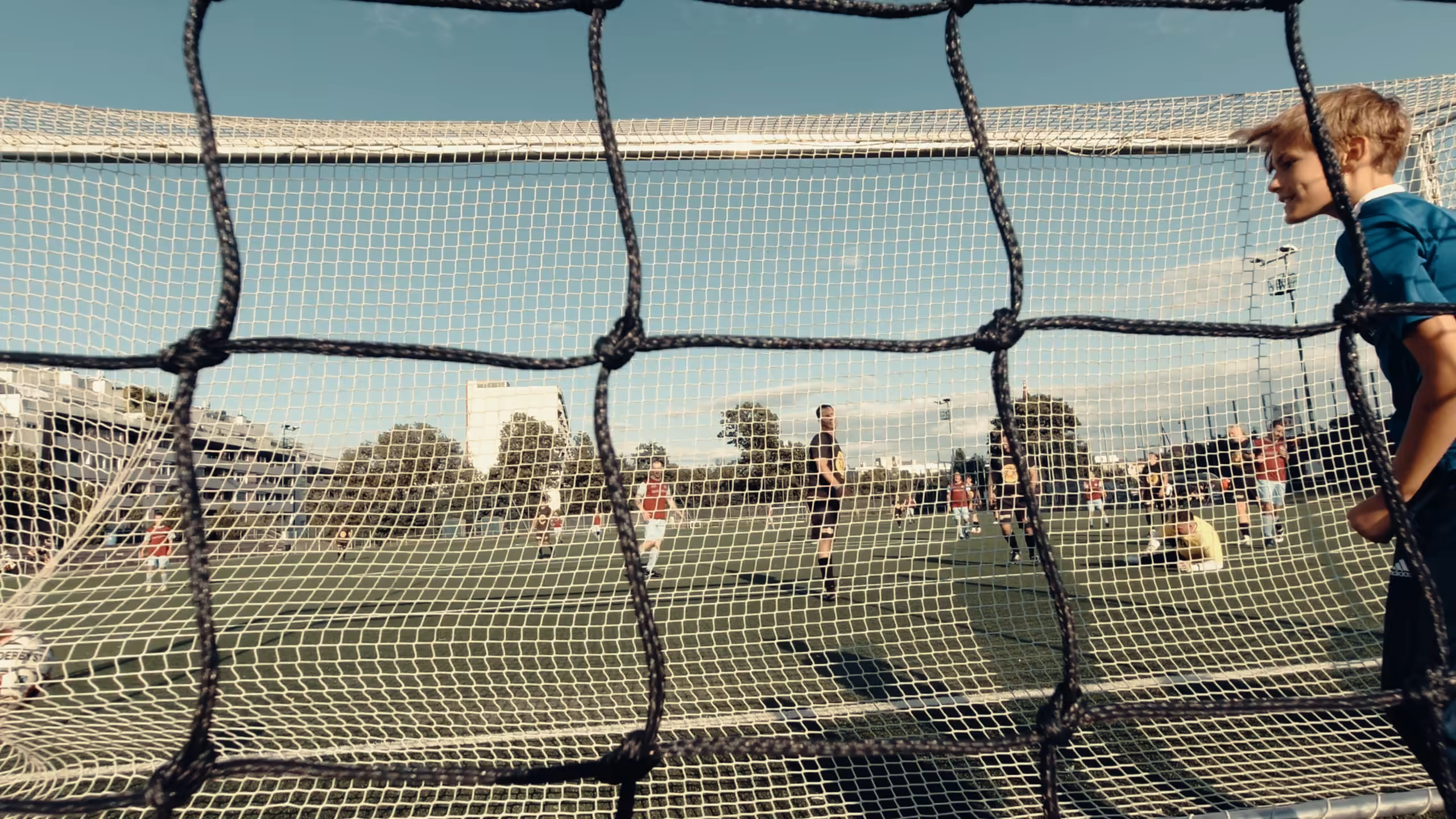 View through the goal net across the pitch